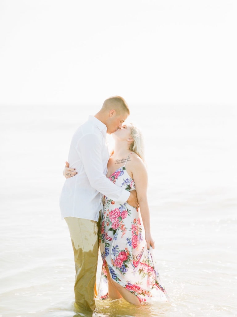 couple kisses on the beach in Tybee Island, GA