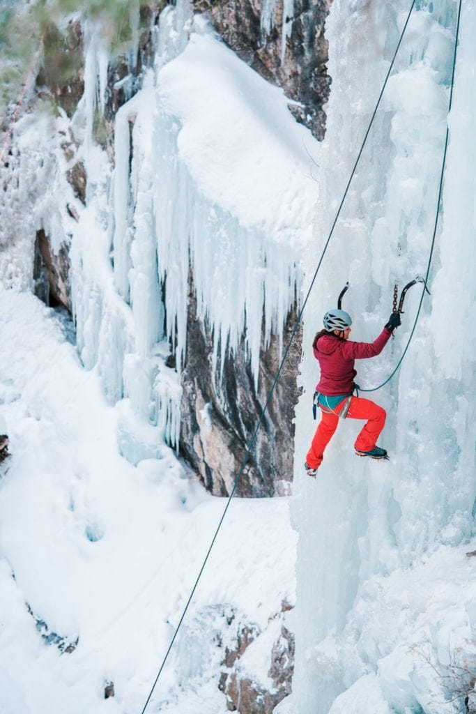 ice climbing in the Ouray Ice Park along the wall of the gorge