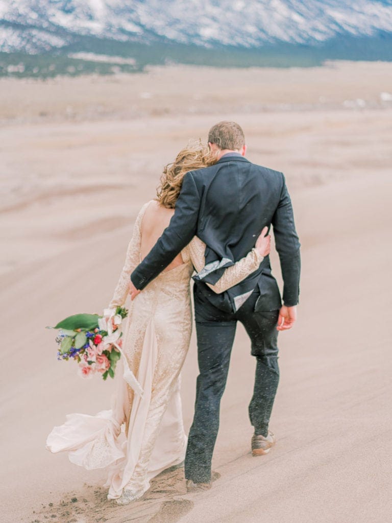 adventure hiking elopement in the sand dunes in Colorado