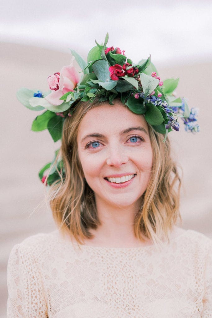 floral crown on a bride during an elopement with cymbidium flowers