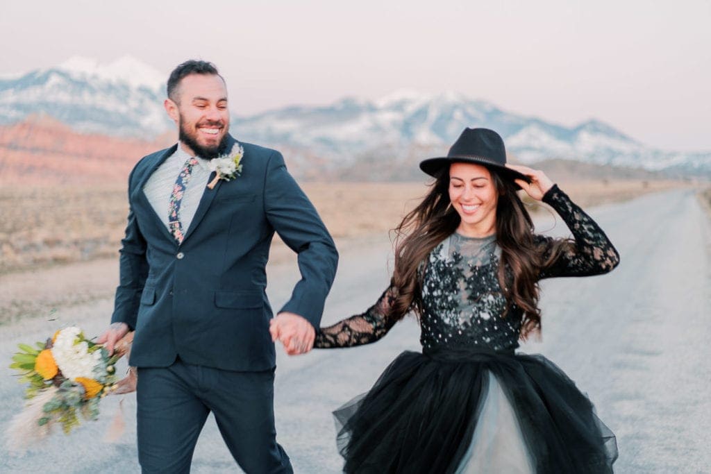 Moab, Utah elopement in a black dress with arches and mountain views