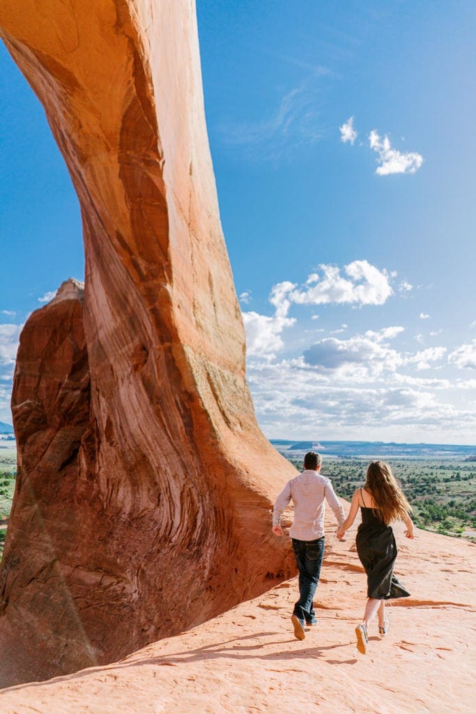 Moab engagement session with arches, a canyon, waterfall, and more!