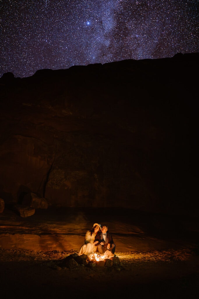 Moab elopement under the stars with a campfire.