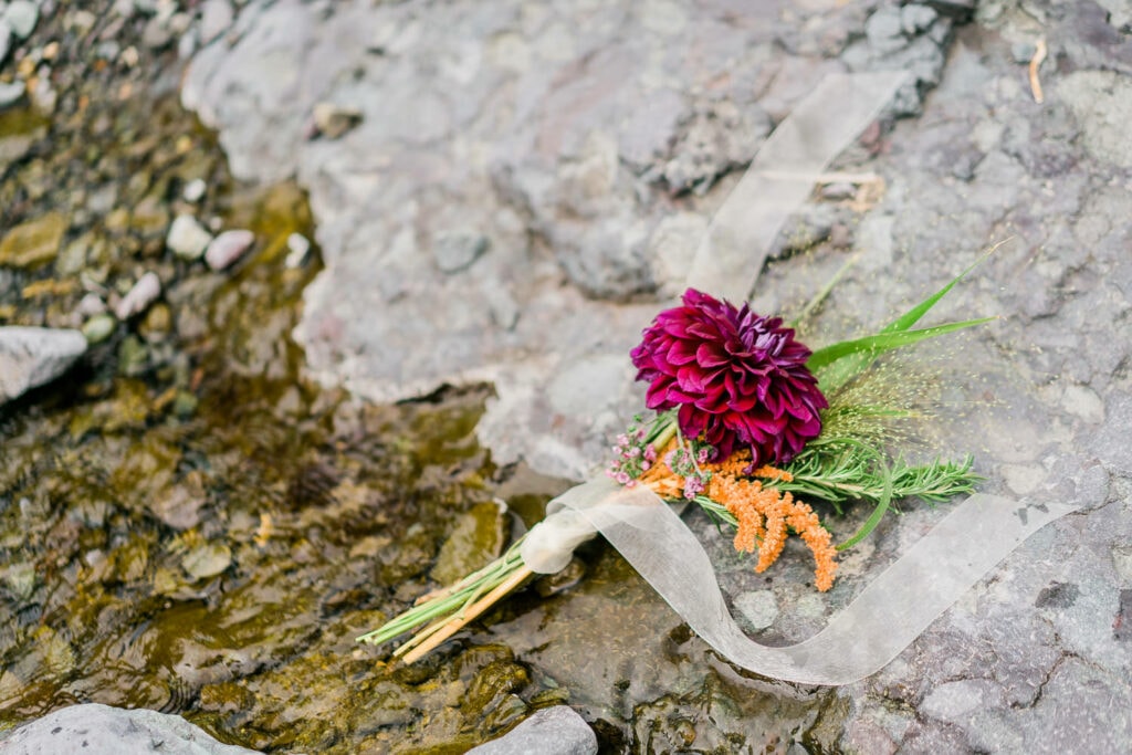 Small wedding bouquet made with a large dahlia flower by Alpenglow Growers.