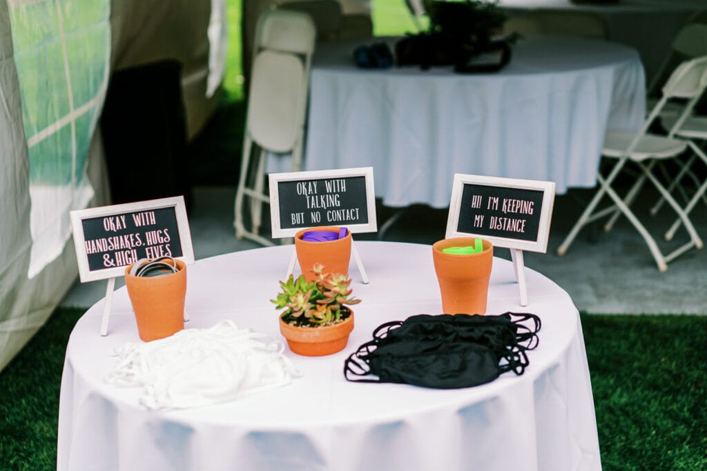 Masks and bracelets for physical distancing preferences at a COVID wedding outdoors in Colorado during the summer of 2020.
