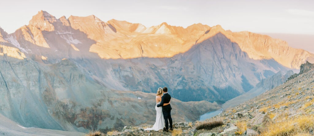 Bride and groom embrace after their ceremony at their Ouray, Colorado elopement in the mountains.