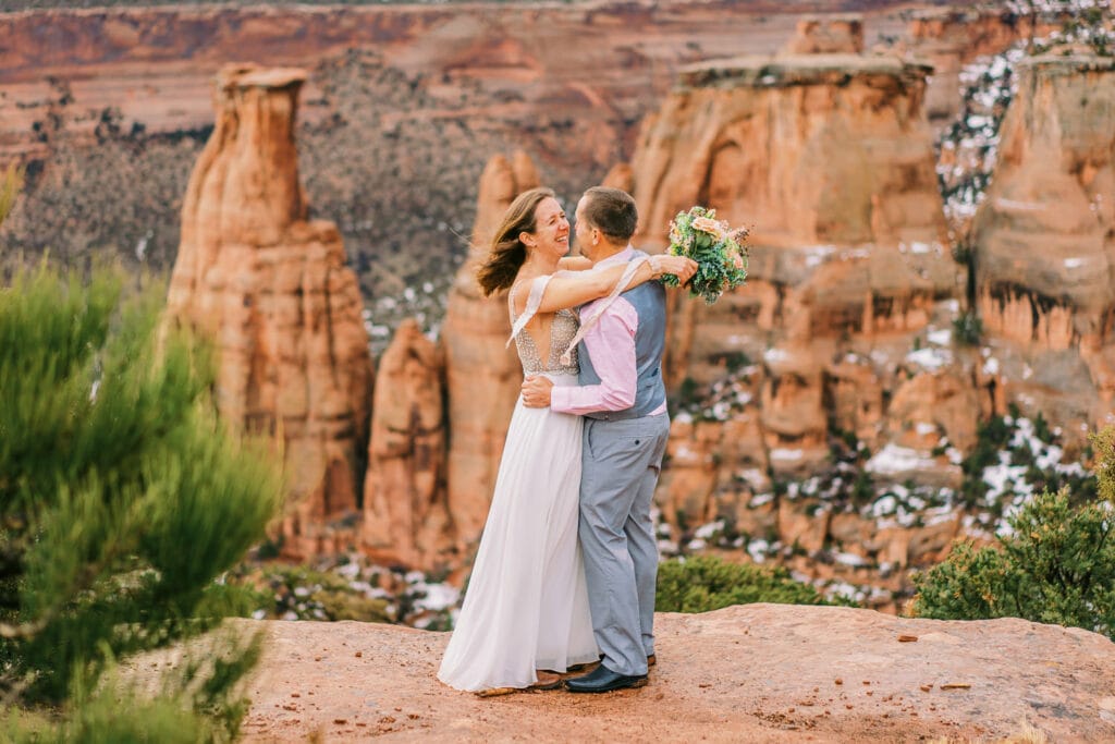 Couple embraces during their elopement at Colorado National Monument.