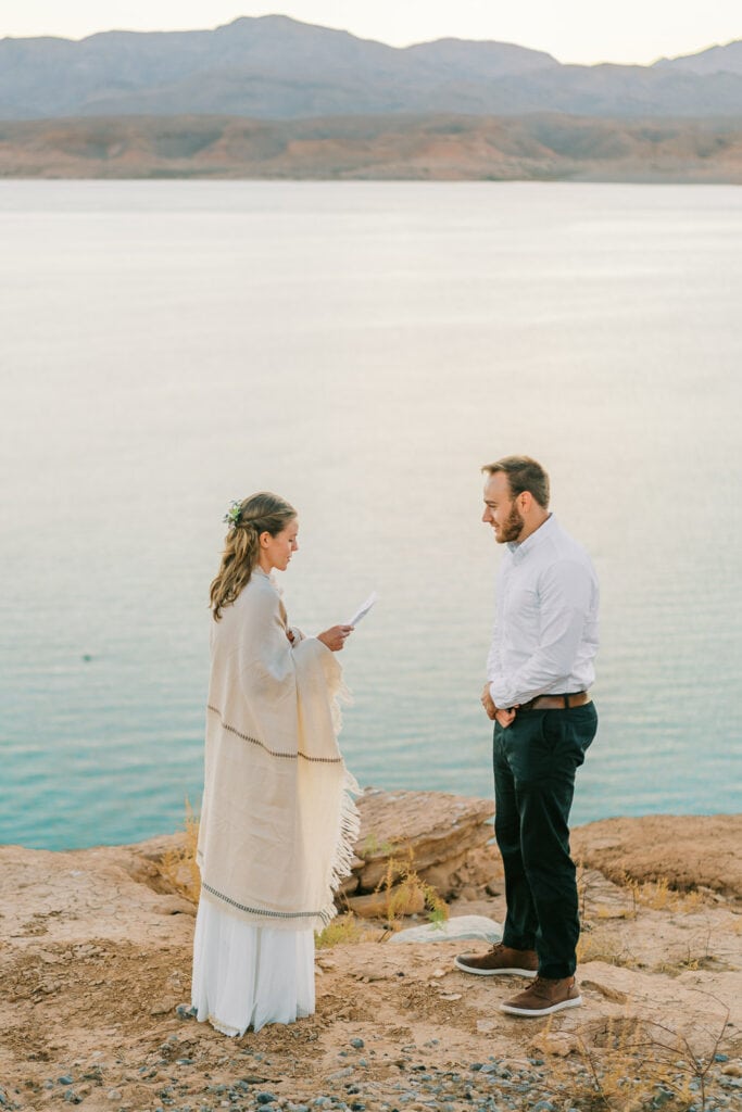 Lake Mead commitment ceremony during an elopement at sunrise in Nevada.