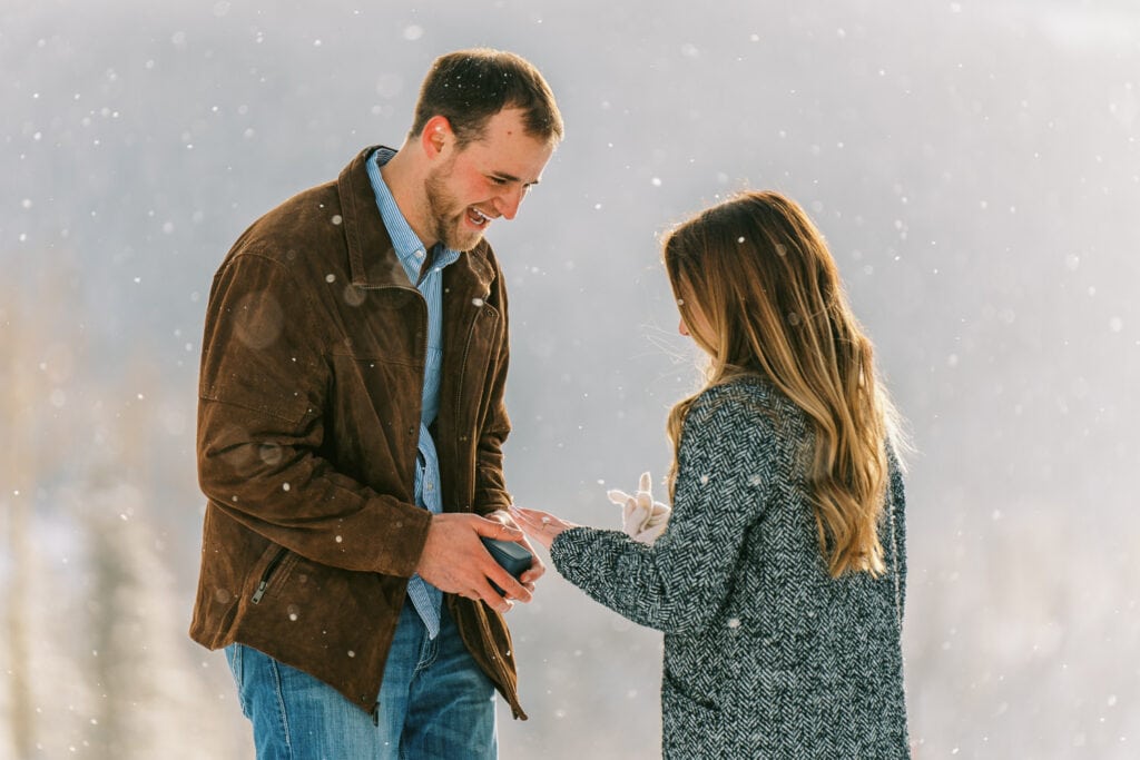 Surprise proposal on a mountain top in Telluride during the winter.