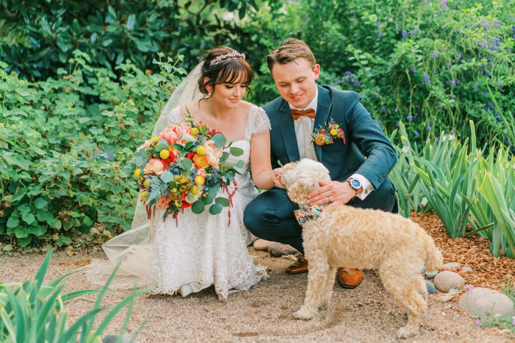 Bride and groom bring their dog to their Tucson Botanical Gardens wedding in Arizona.