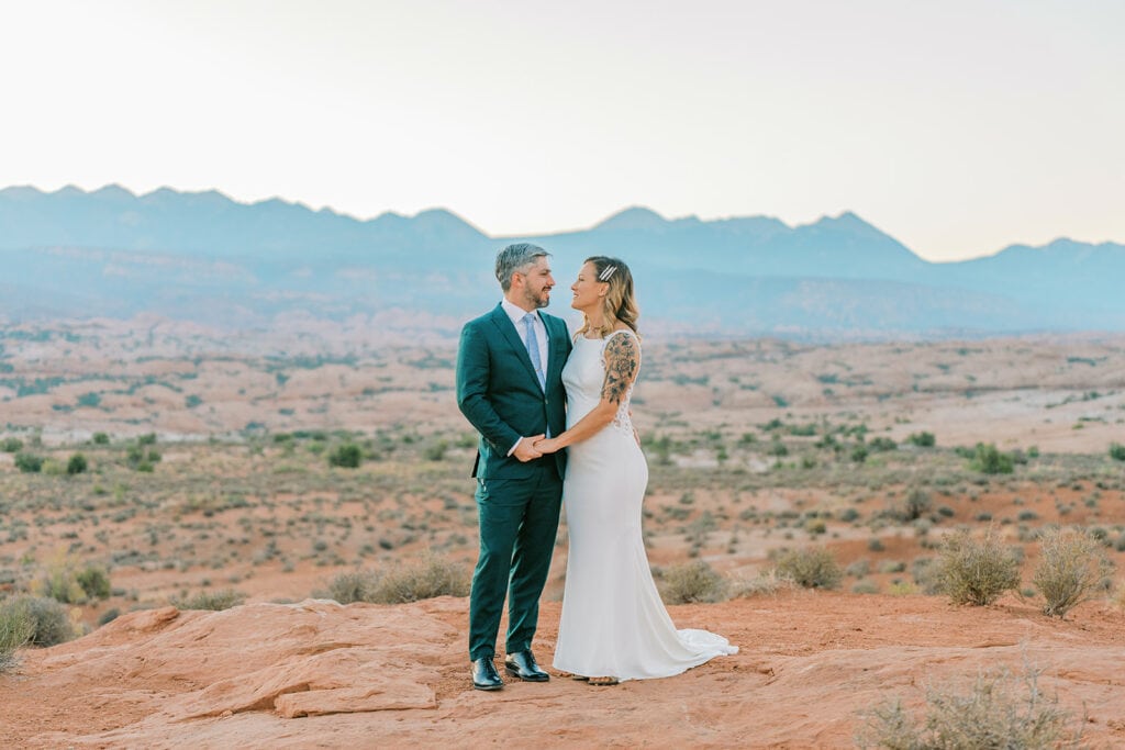 Elopement at La Sal Viewpoint in Arches National Park at sunrise.