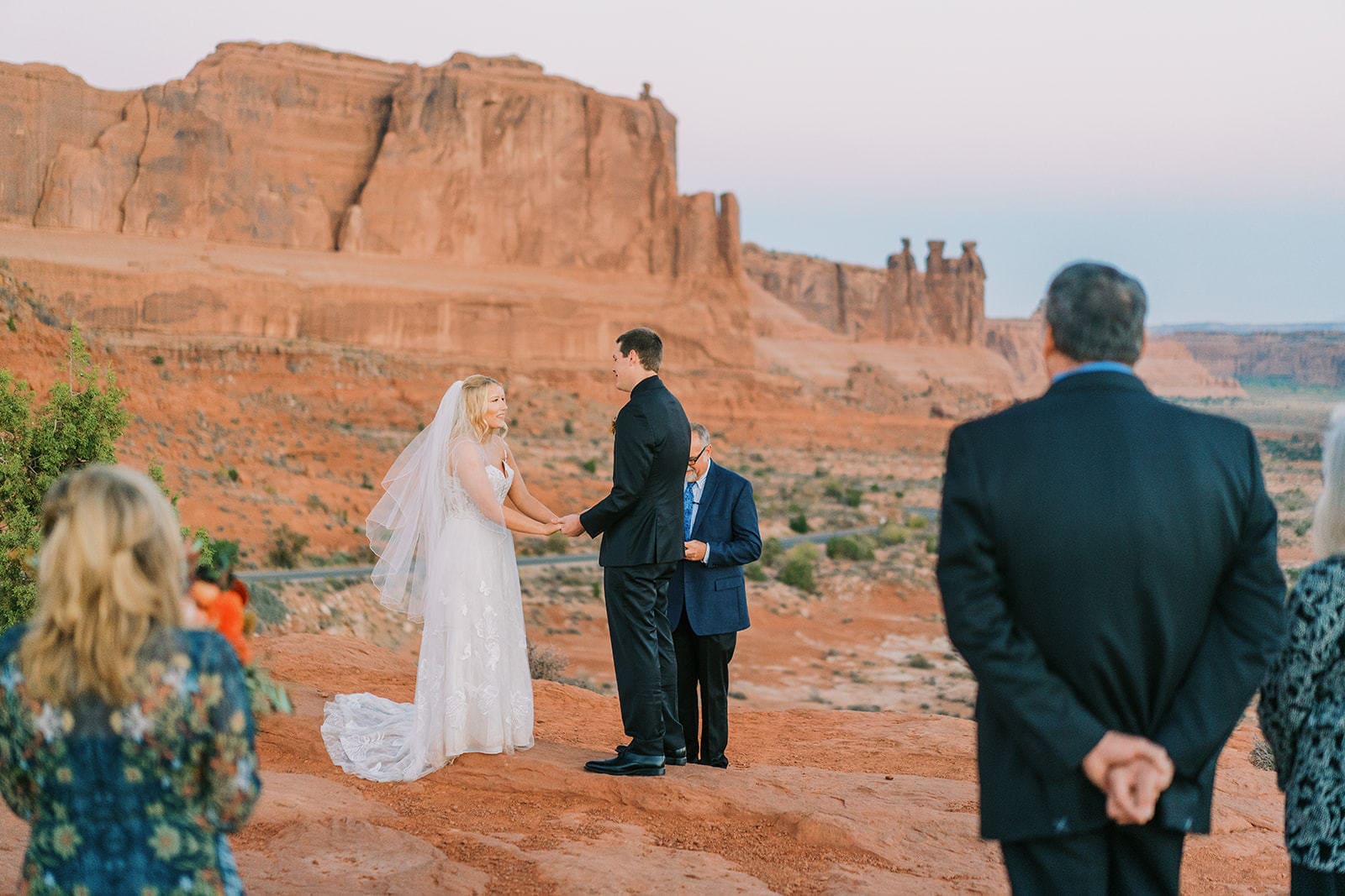 Couple gets married in Arches National Park at the La Sal Viewpoint at sunrise.