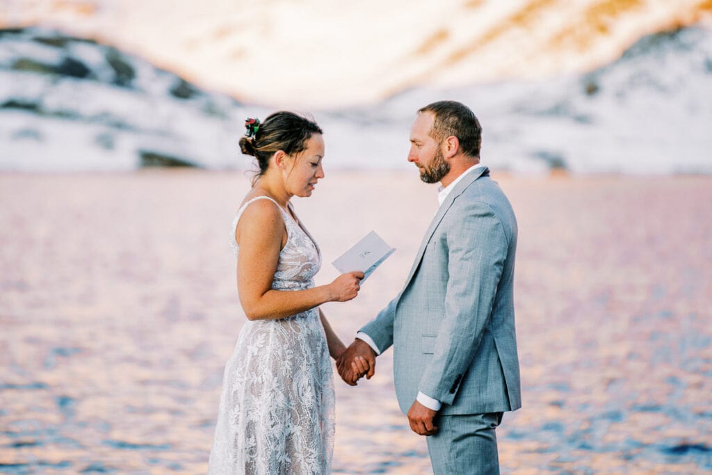 Bride and groom sharing vows at their elopement in Silverton, Colorado on the western slope.