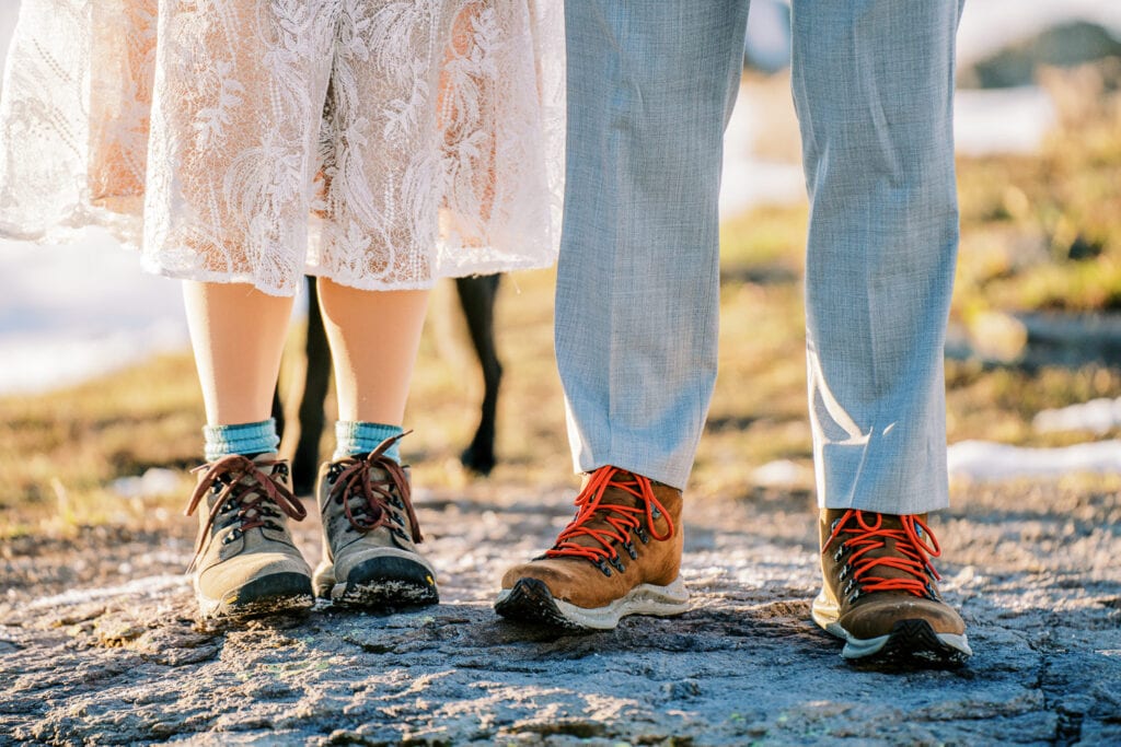 Bride and groom wear hiking shoes to their Silverton elopement in western Colorado.