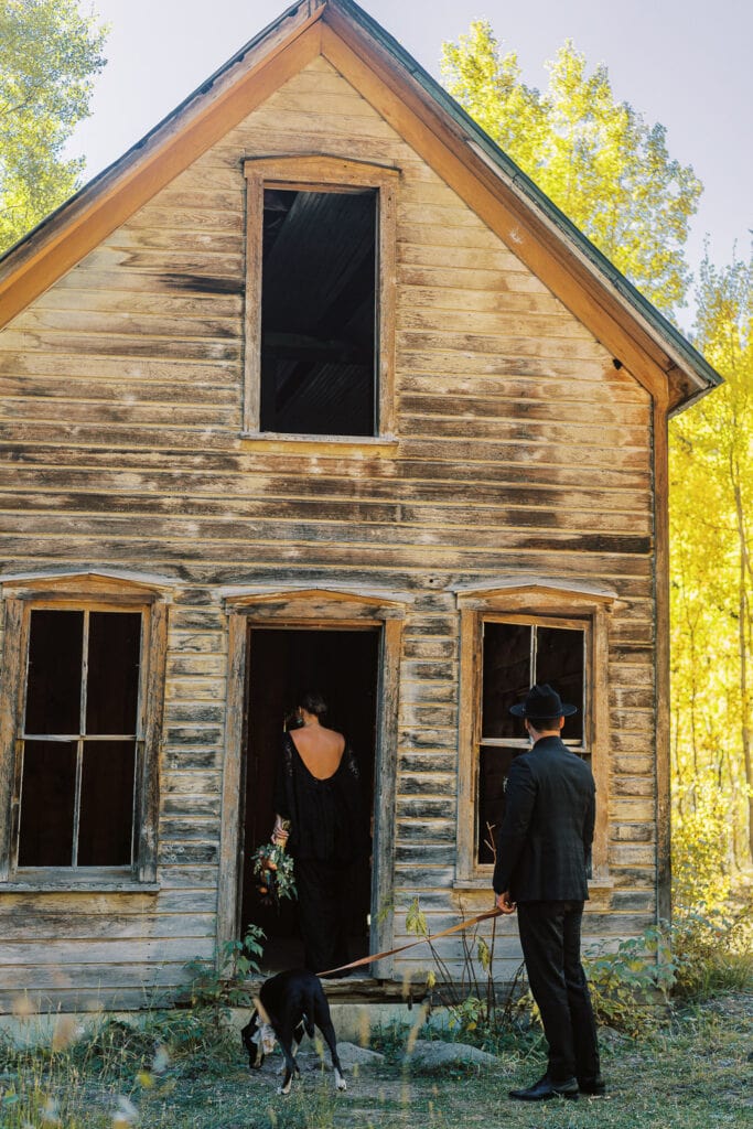 Bride and groom exploring a ghost town during their elopement.