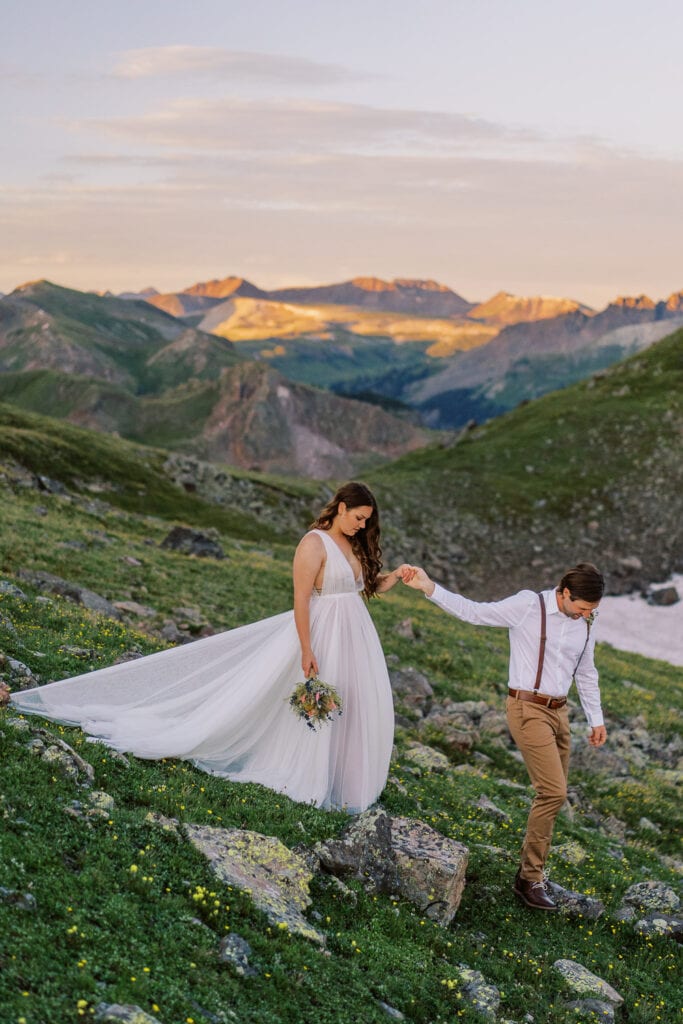 Elopement in western Colorado with a bride and groom hiking.