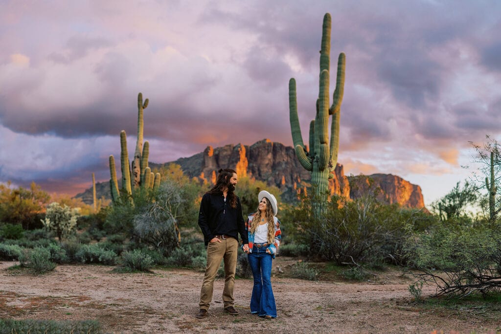 Couple's photography session in the Tucson desert in Arizona with cacti.