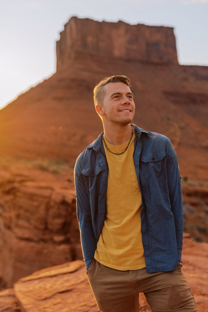 Portrait of Moab elopement photographer - Malachi Lewis from Shell Creek Photography at sunset in the desert.