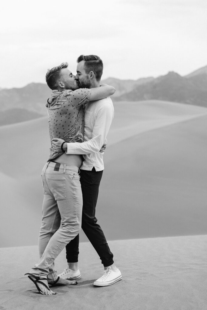 Two guys kissing during a same sex gay engagement session.